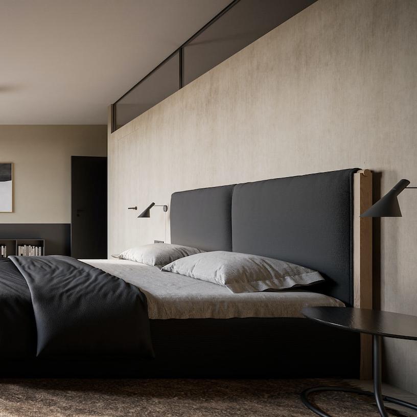 a bedroom with a bed, desk and television